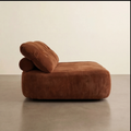 Brown sofa with a unique design on a plain background